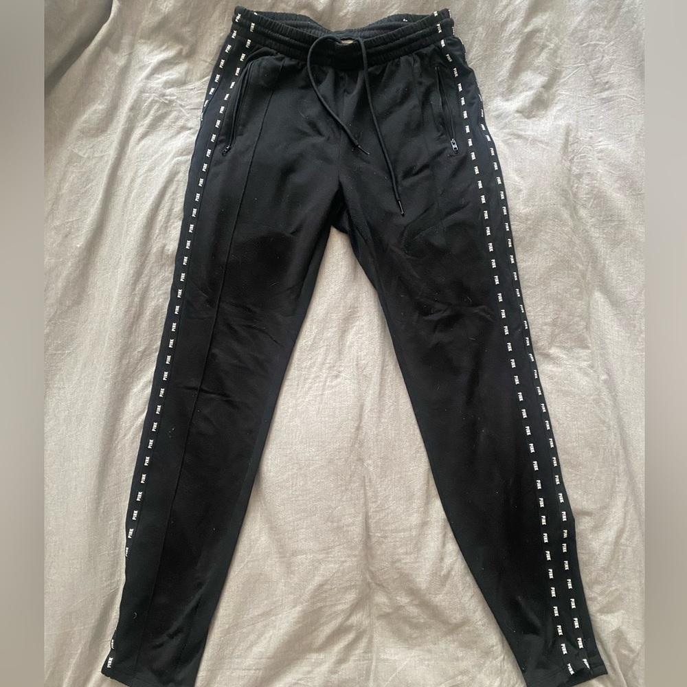Joggers from pink. Zipper on the side of both ankles.